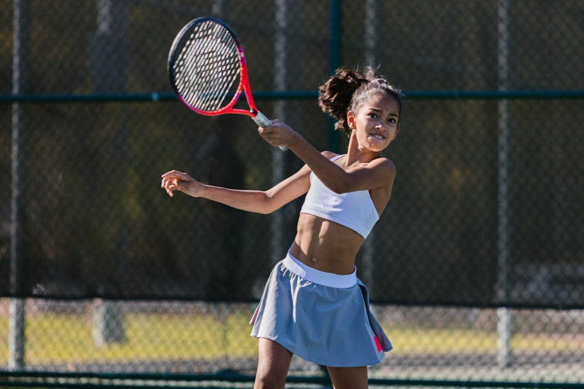 Junior tennis player on court